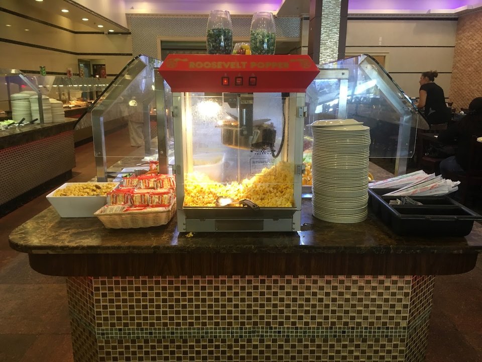 Spacious buffet dining room with long serving stations.